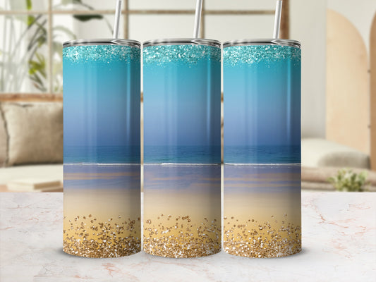 Three tumblers with beach and glitter designs, a serene ocean and sand scene.