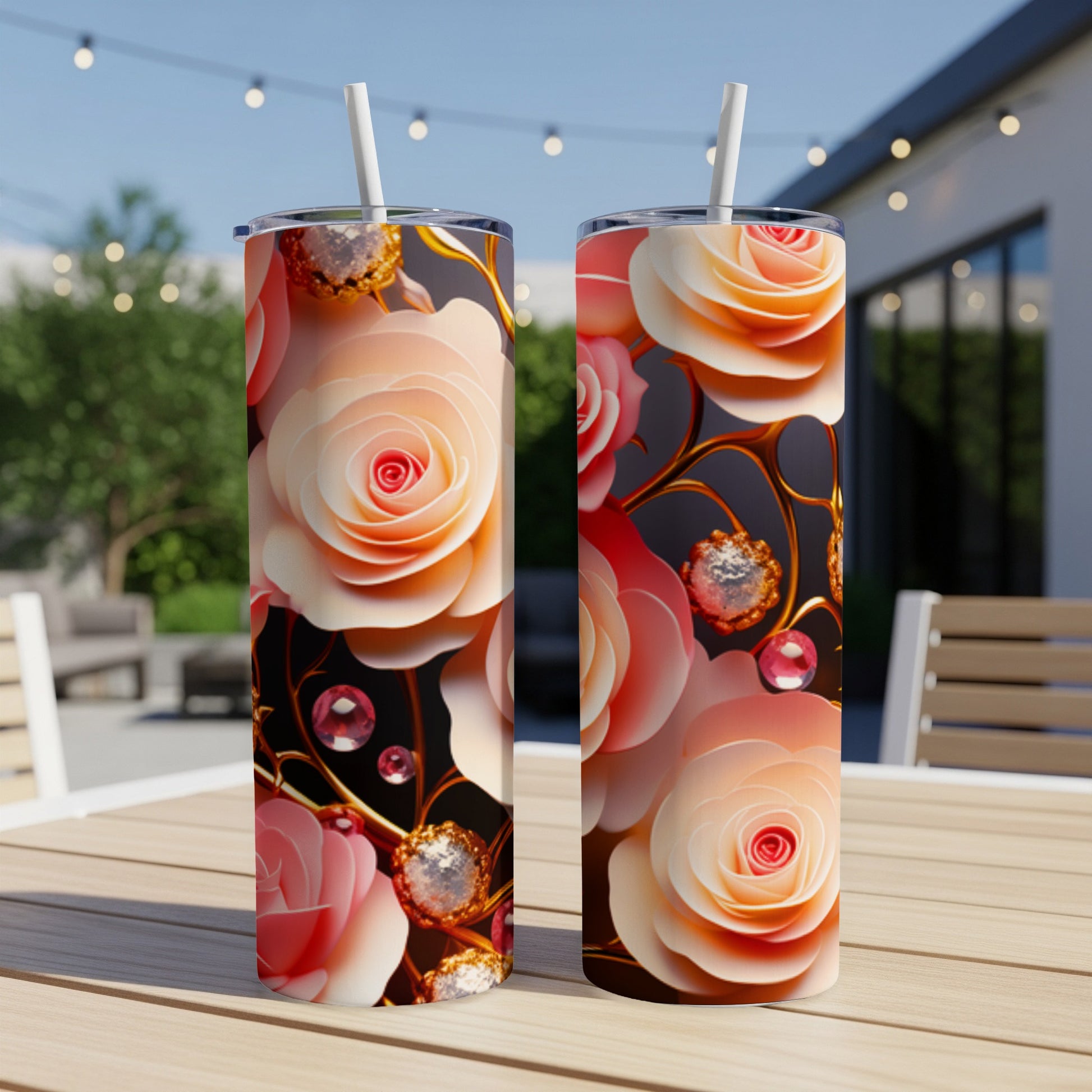 Two tall tumblers with swirling pink and peach roses and jewels.