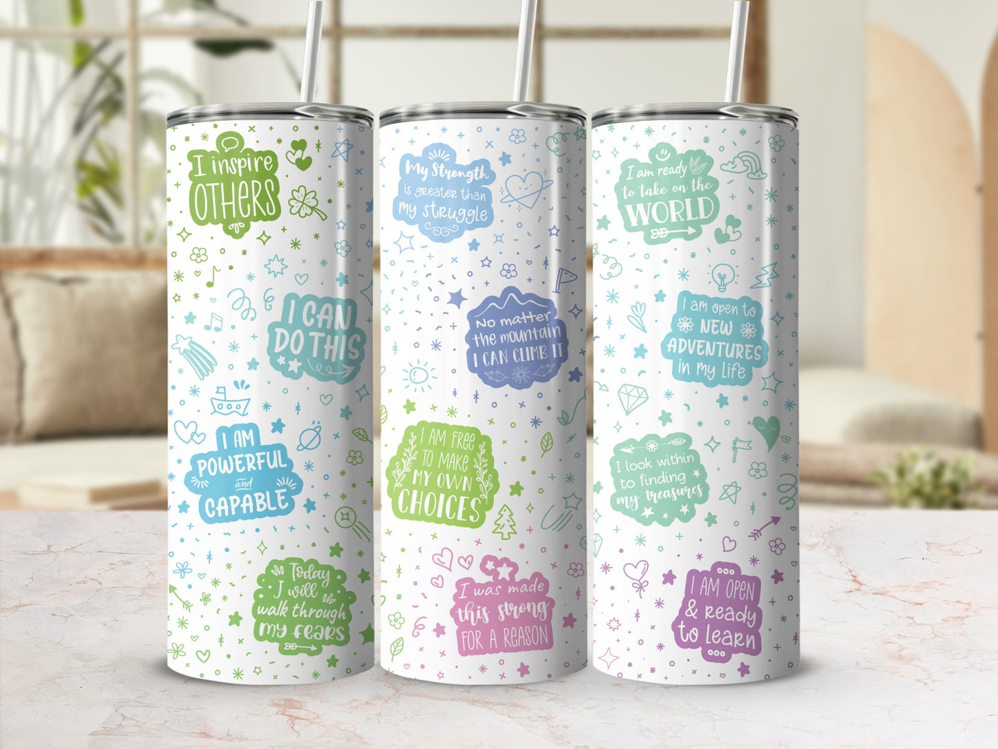 Three tumblers with positive affirmations and colorful illustrations.