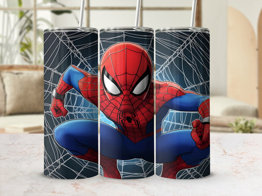 Spiderman in a web-patterned tumbler against a blurred background.