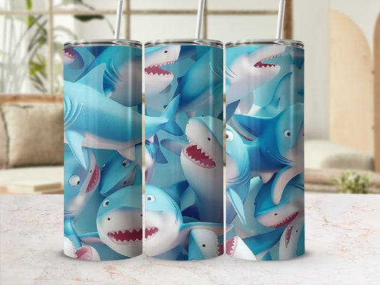 Three tumblers with a repeating pattern of cartoonish blue sharks.