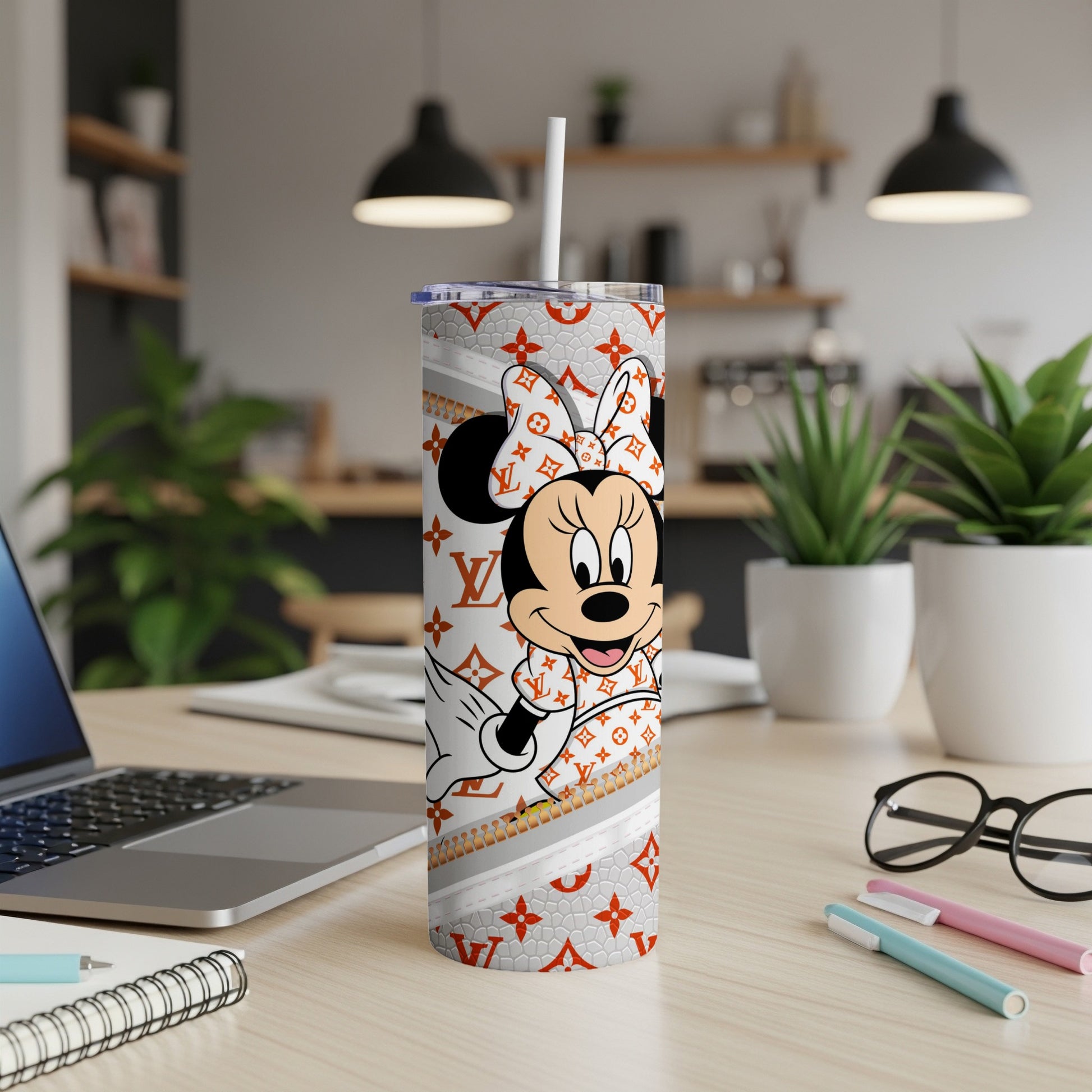 Minnie Mouse in Louis Vuitton pattern on a white tumbler with straw.