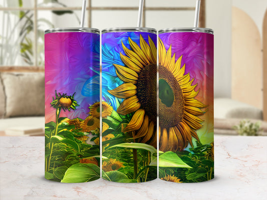 Three tall tumblers with a vibrant sunflower design, set against a colorful abstract background.