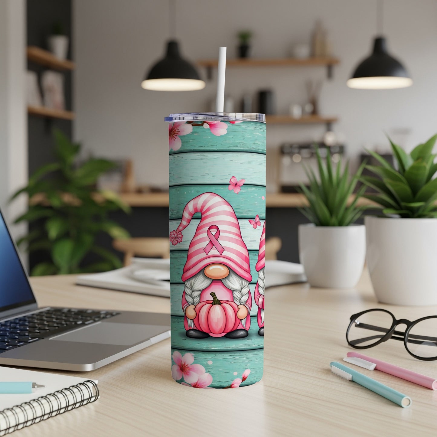 Pink gnome with ribbon on striped tumbler with floral and butterfly details.
