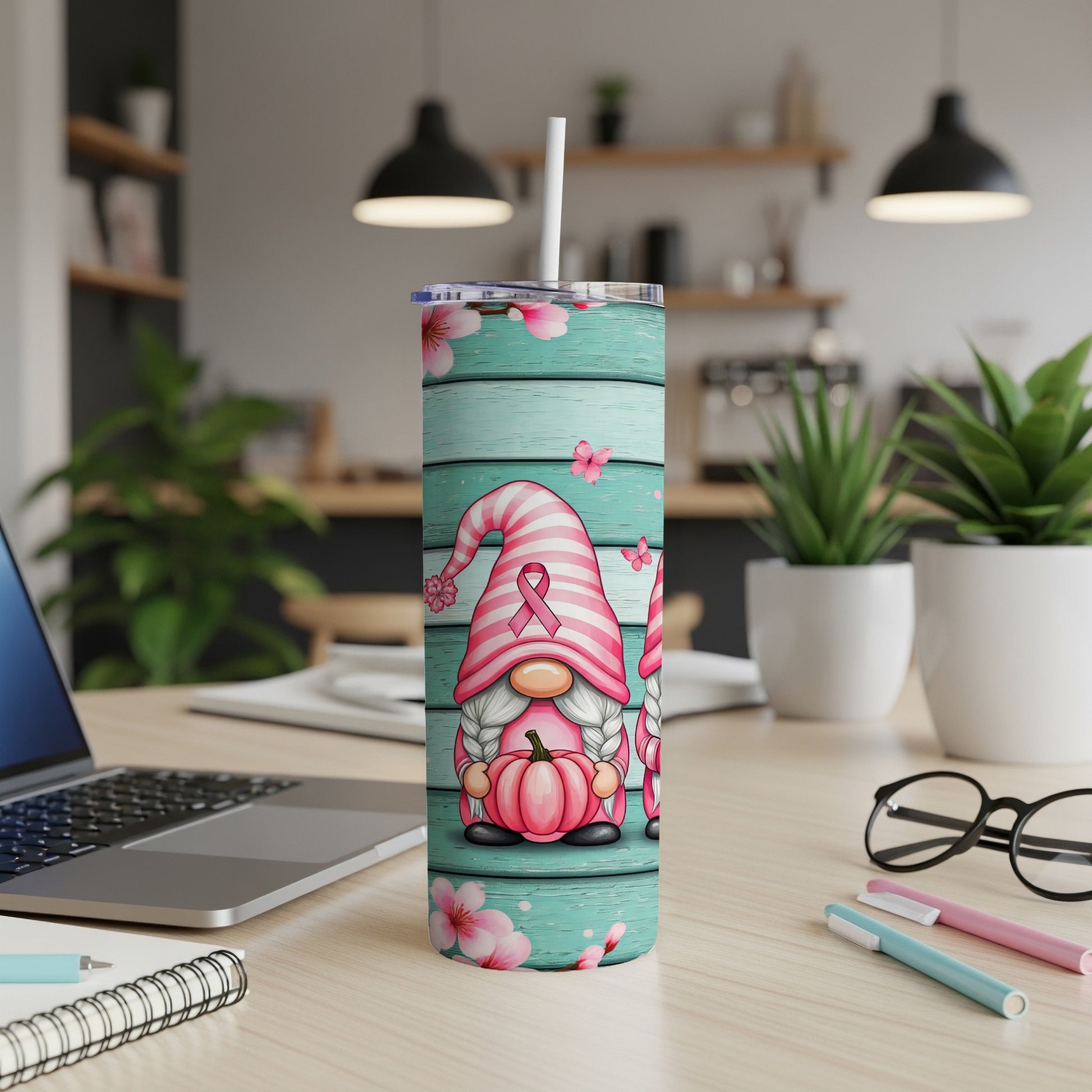 Pink gnome with ribbon on striped tumbler with floral and butterfly details.