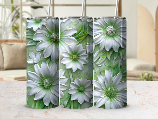 Three tumblers with white floral designs against a soft green textured background.