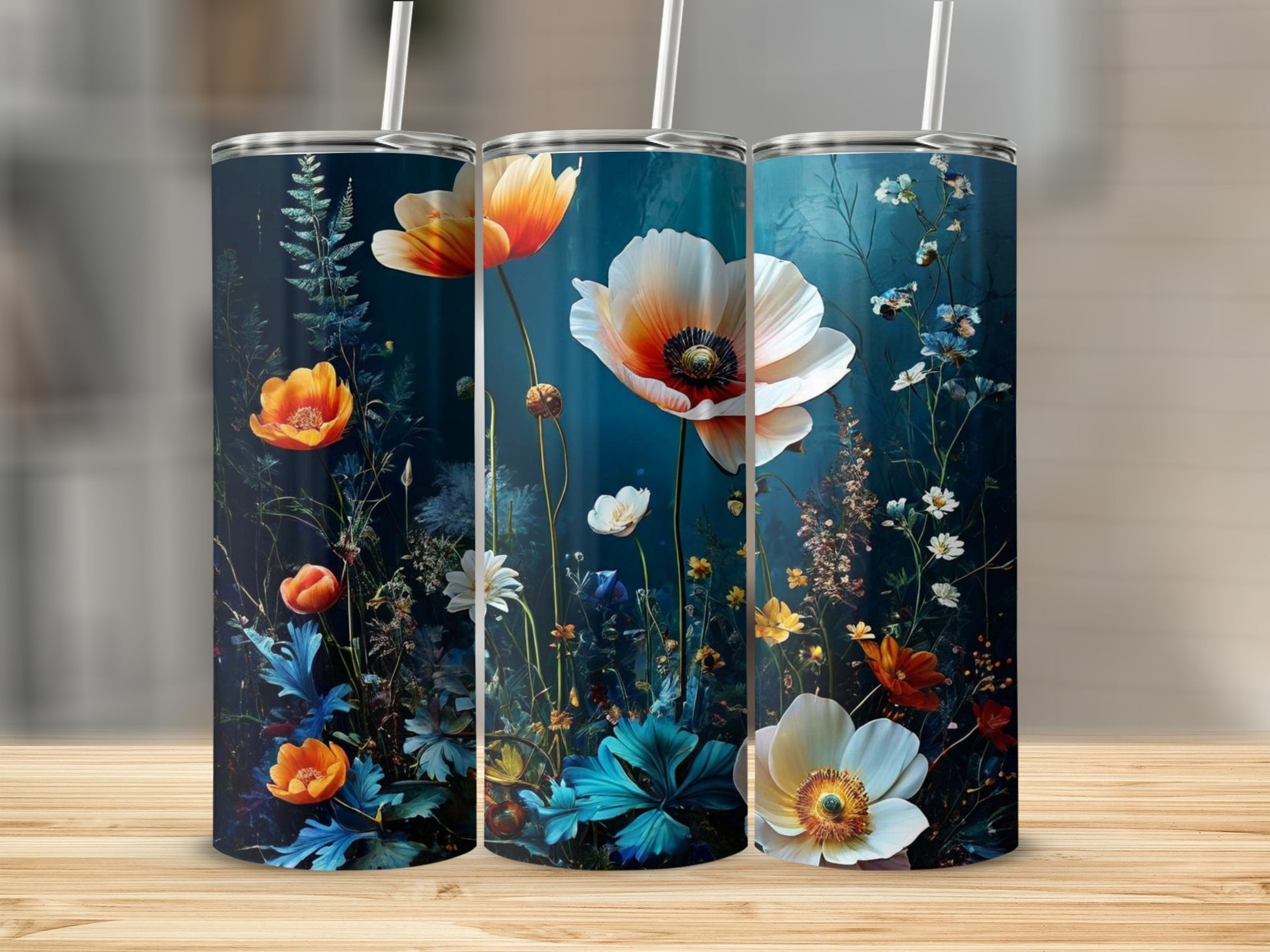 Three tumblers with a dark floral design featuring poppies and other wildflowers.