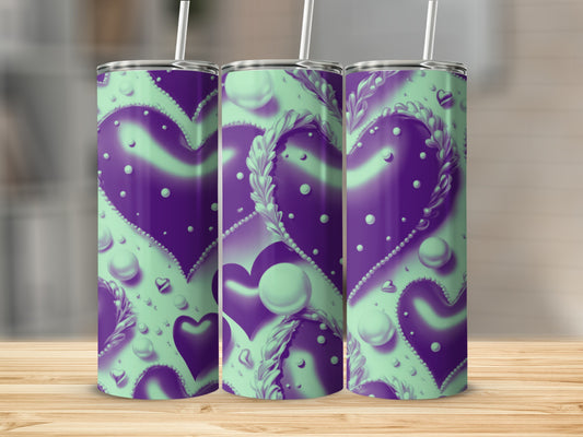 Three purple and mint green tumblers with heart and pearl designs.