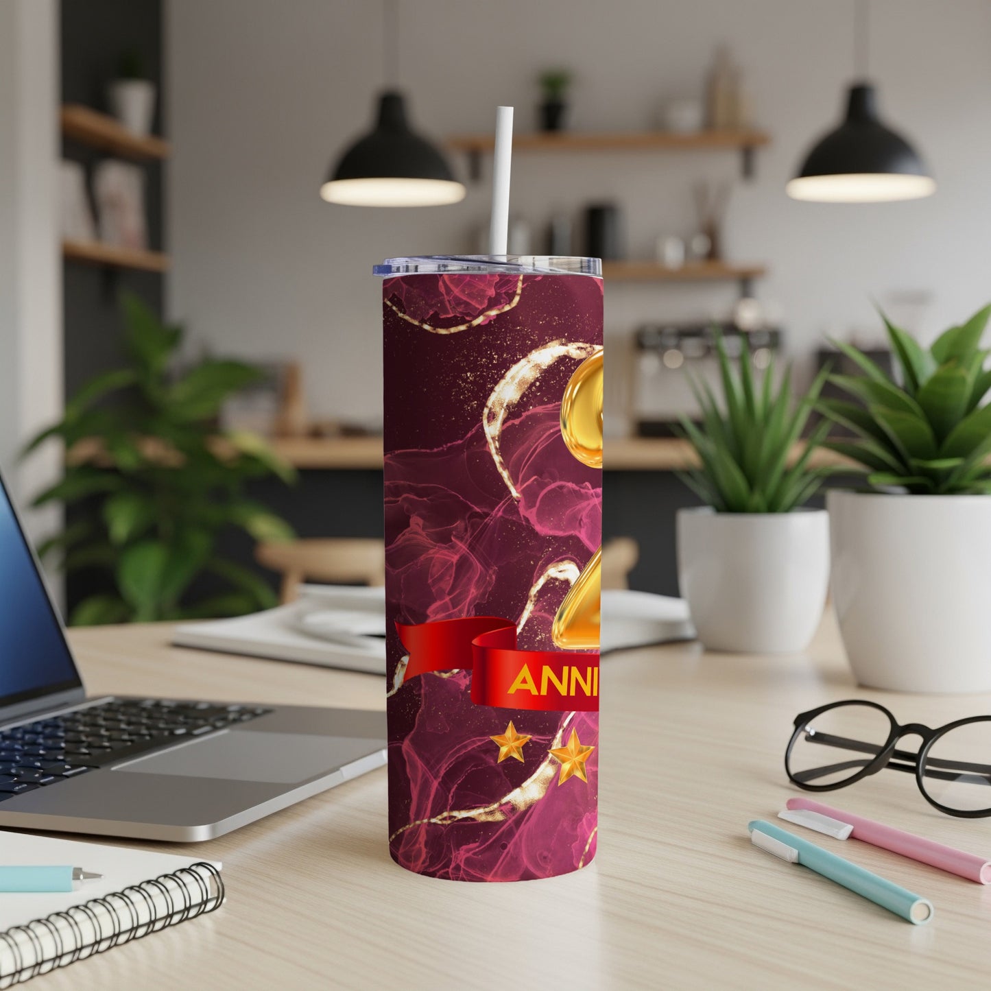 Maroon tumbler with gold abstract pattern and "Anniversary" text.