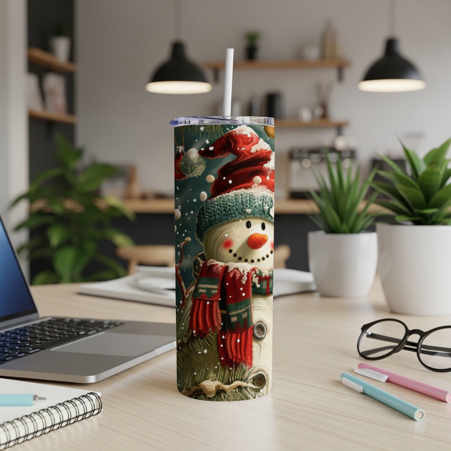 Snowman in Santa hat with striped scarf on festive tumbler with straw.