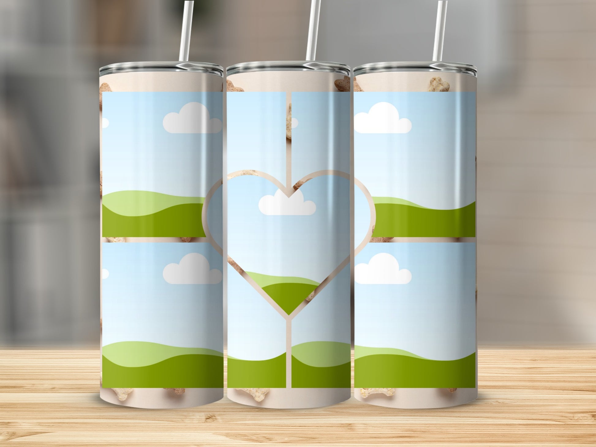 Three tumblers with a landscape design featuring a heart cutout in the center.
