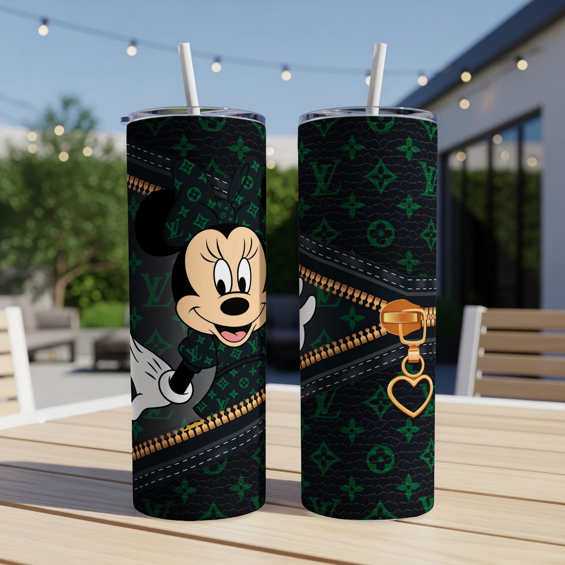 Minnie Mouse on black patterned tumbler with gold zipper detail.
