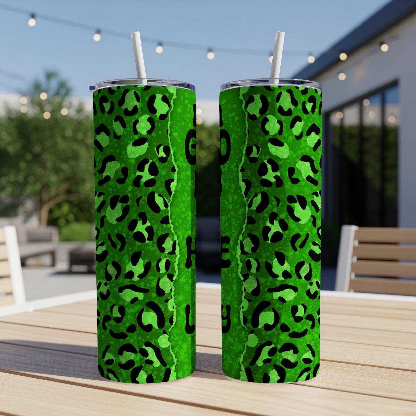 Green leopard print tumblers with black spots and white straws.
