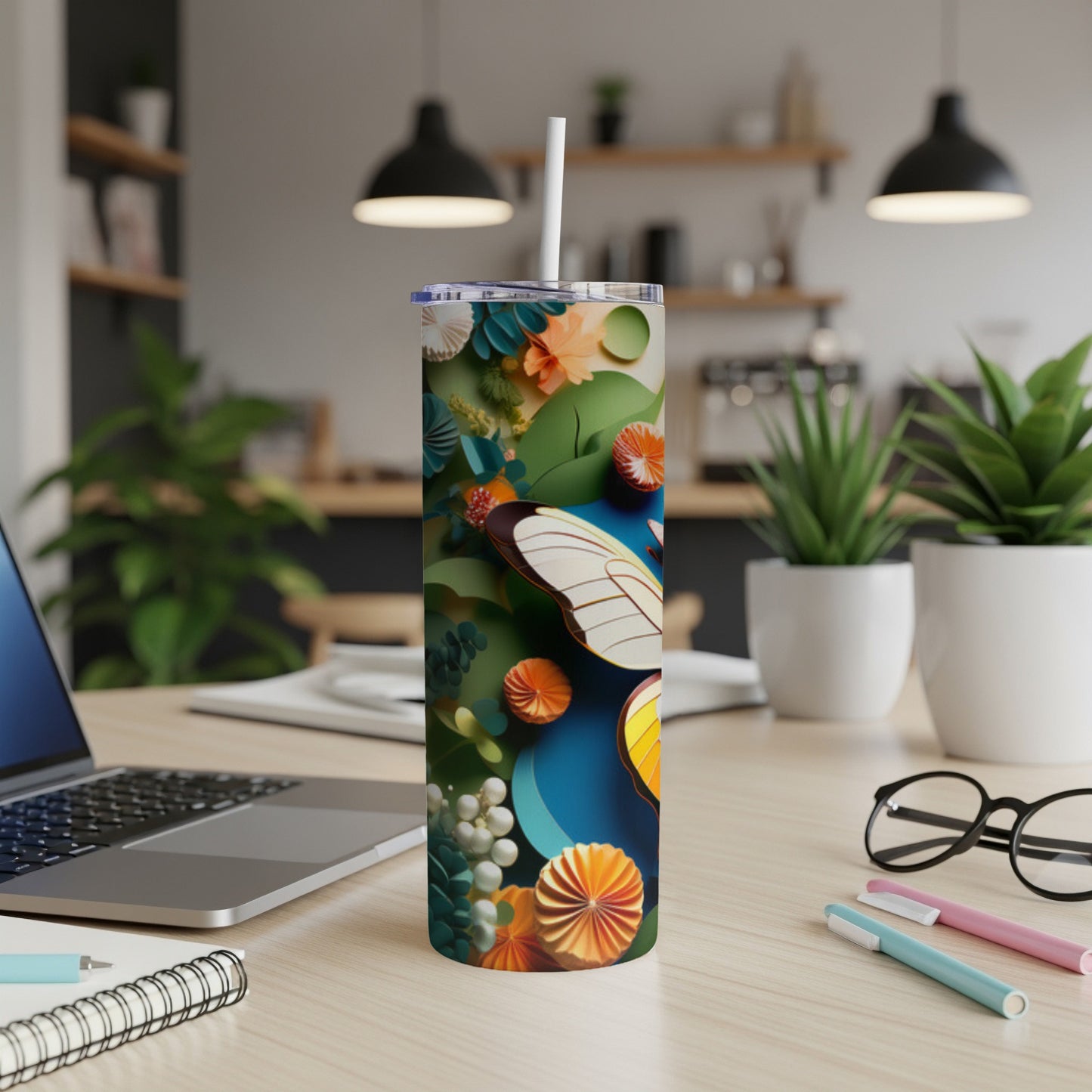 White butterfly and colorful floral design on a tall, slender tumbler.