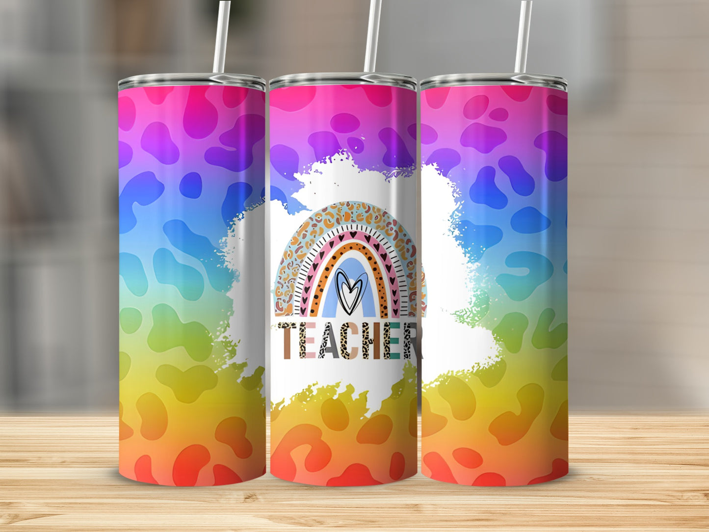 Rainbow leopard print tumbler with "Teacher" text.