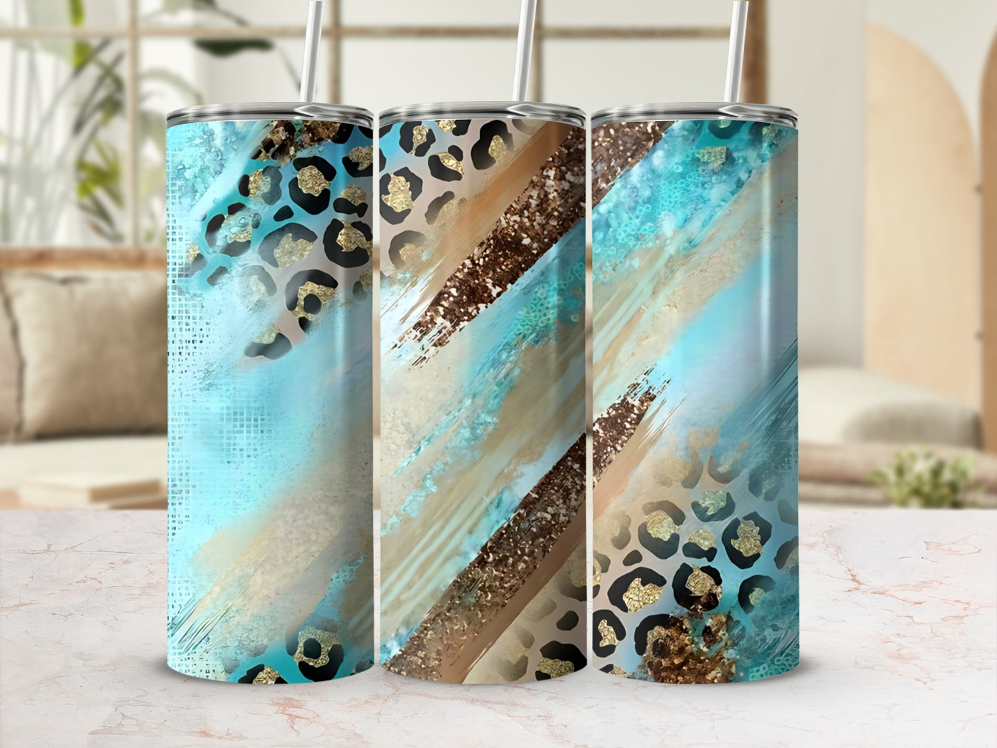 Three tumblers with turquoise, gold, and leopard print designs.