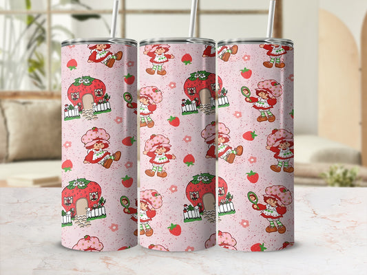 Pink tumbler with repeating Strawberry Shortcake pattern.