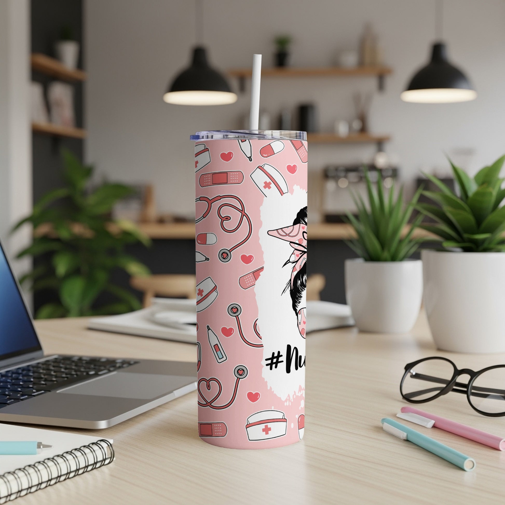 Pink tumbler with medical icons and "#NurseLife" text.