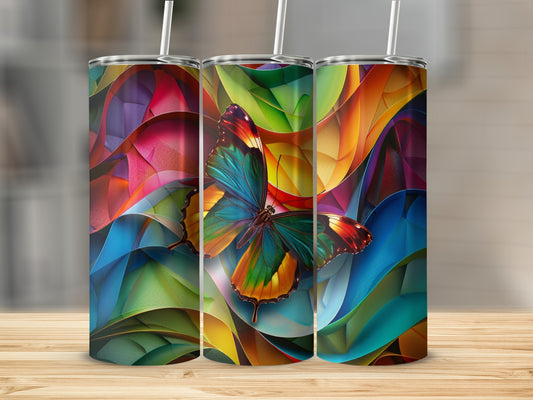 Three tumblers with colorful butterfly art and abstract backgrounds.