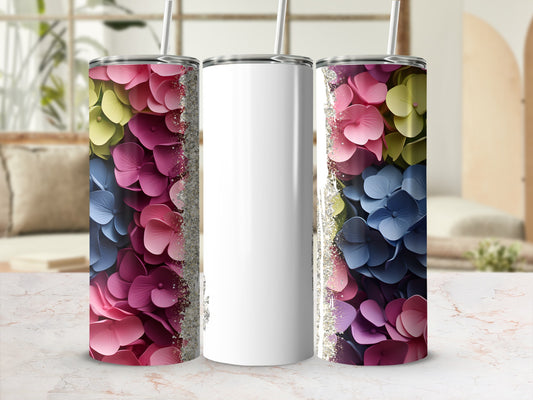 White tumbler with colorful floral print and glitter accents.