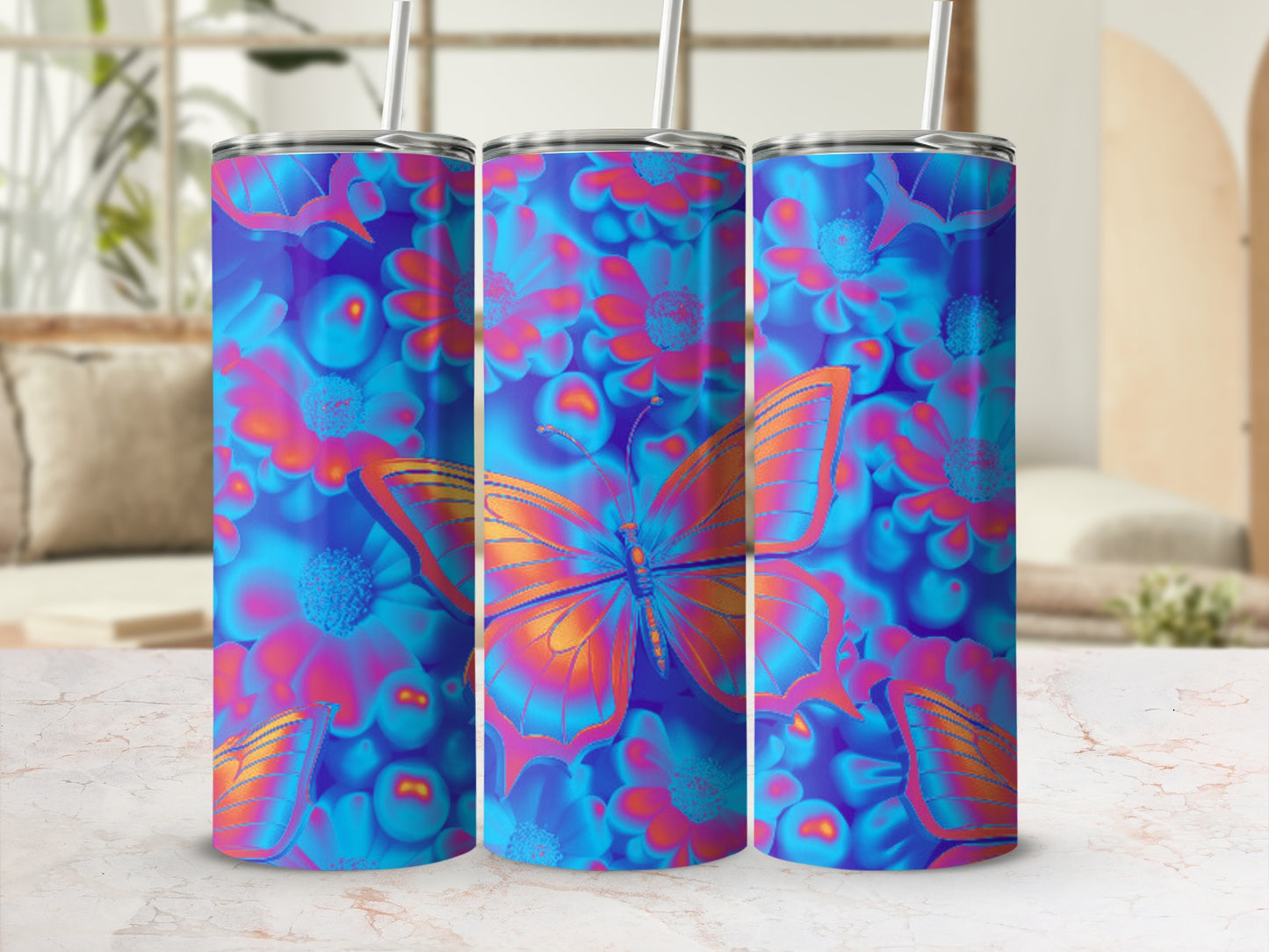 Three tumblers with a vibrant blue floral and orange butterfly design.