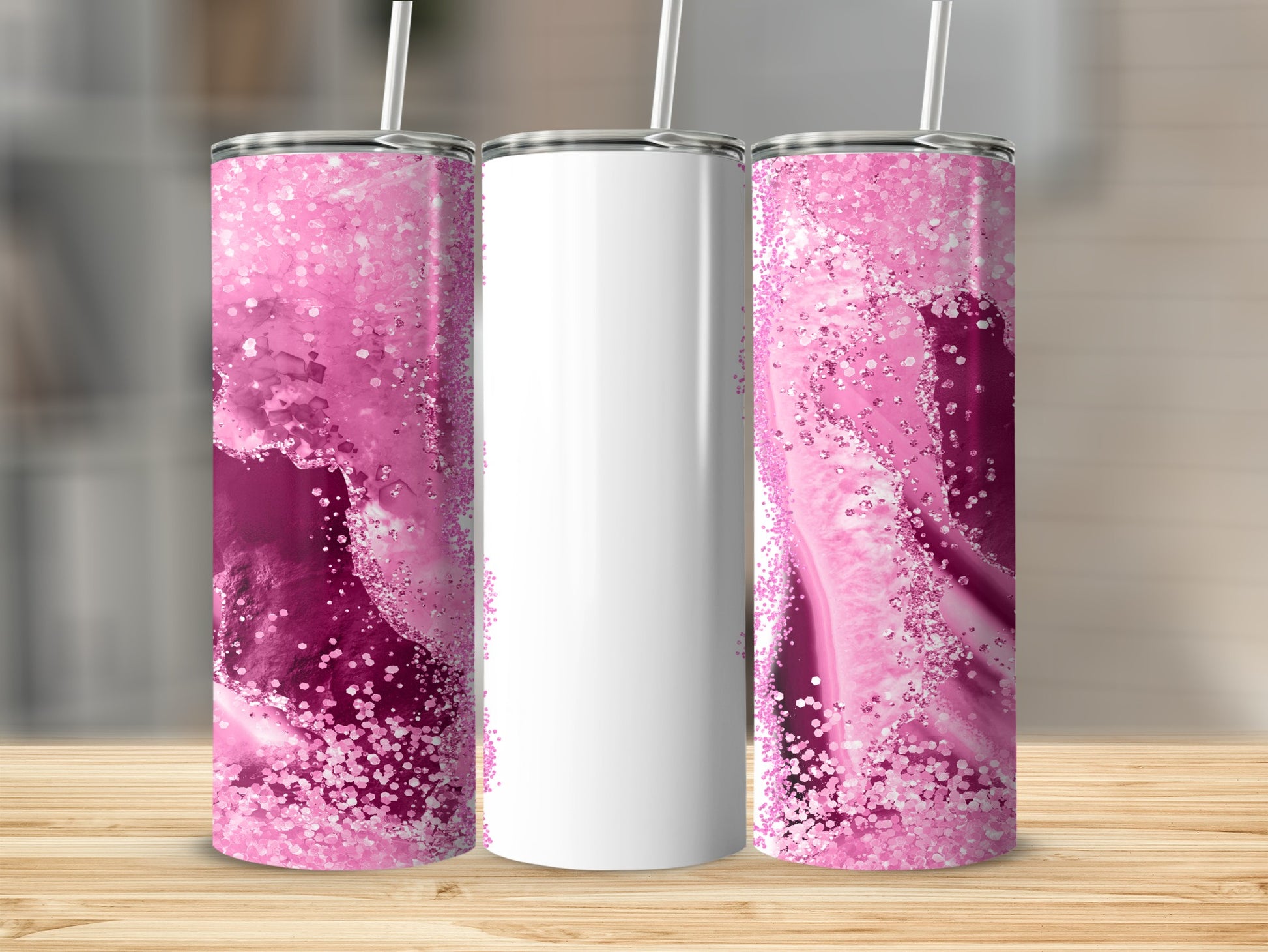 Two tall tumblers with pink and white glitter patterns.