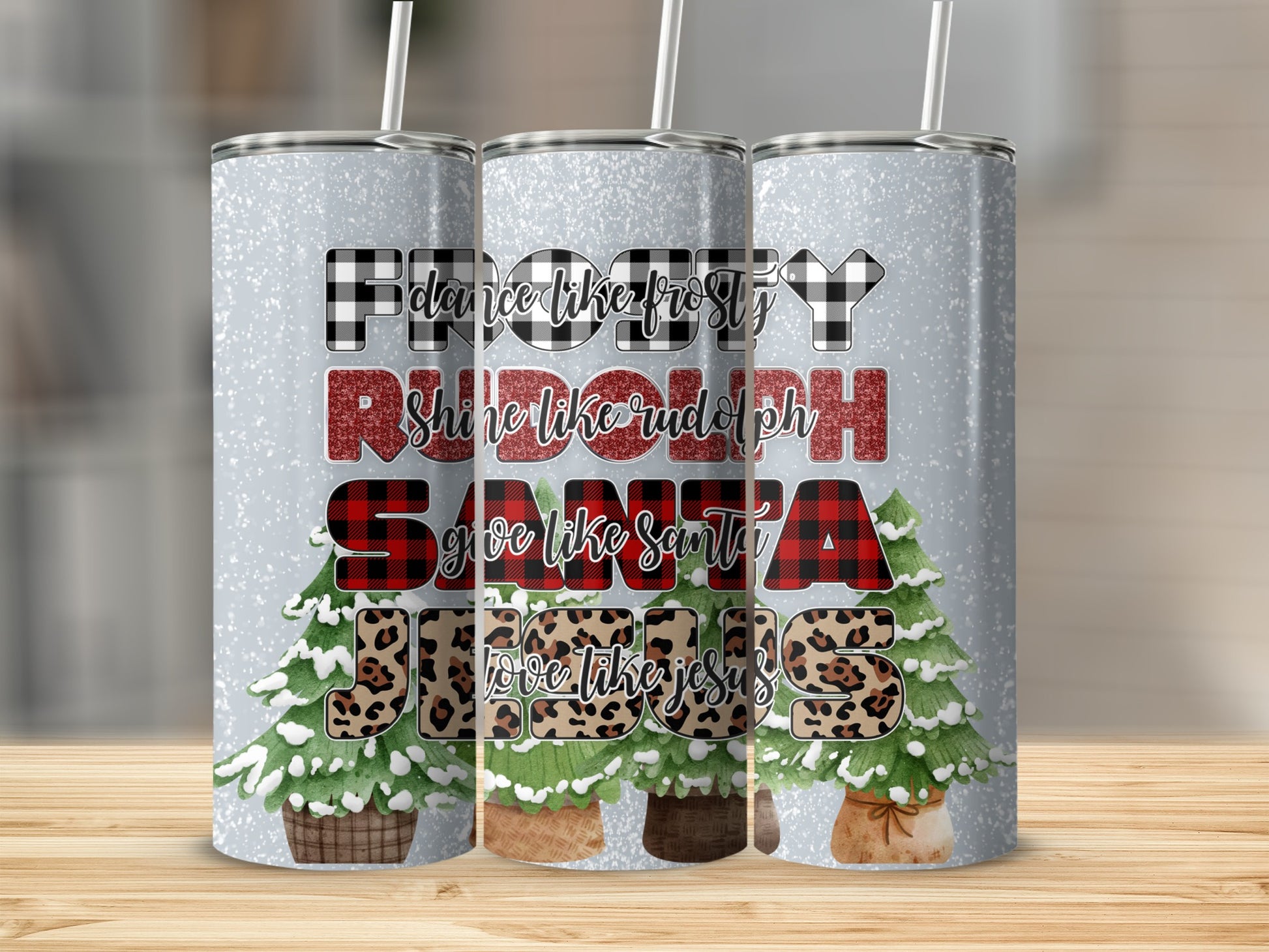 Christmas tumbler with festive text, trees, and plaid patterns.