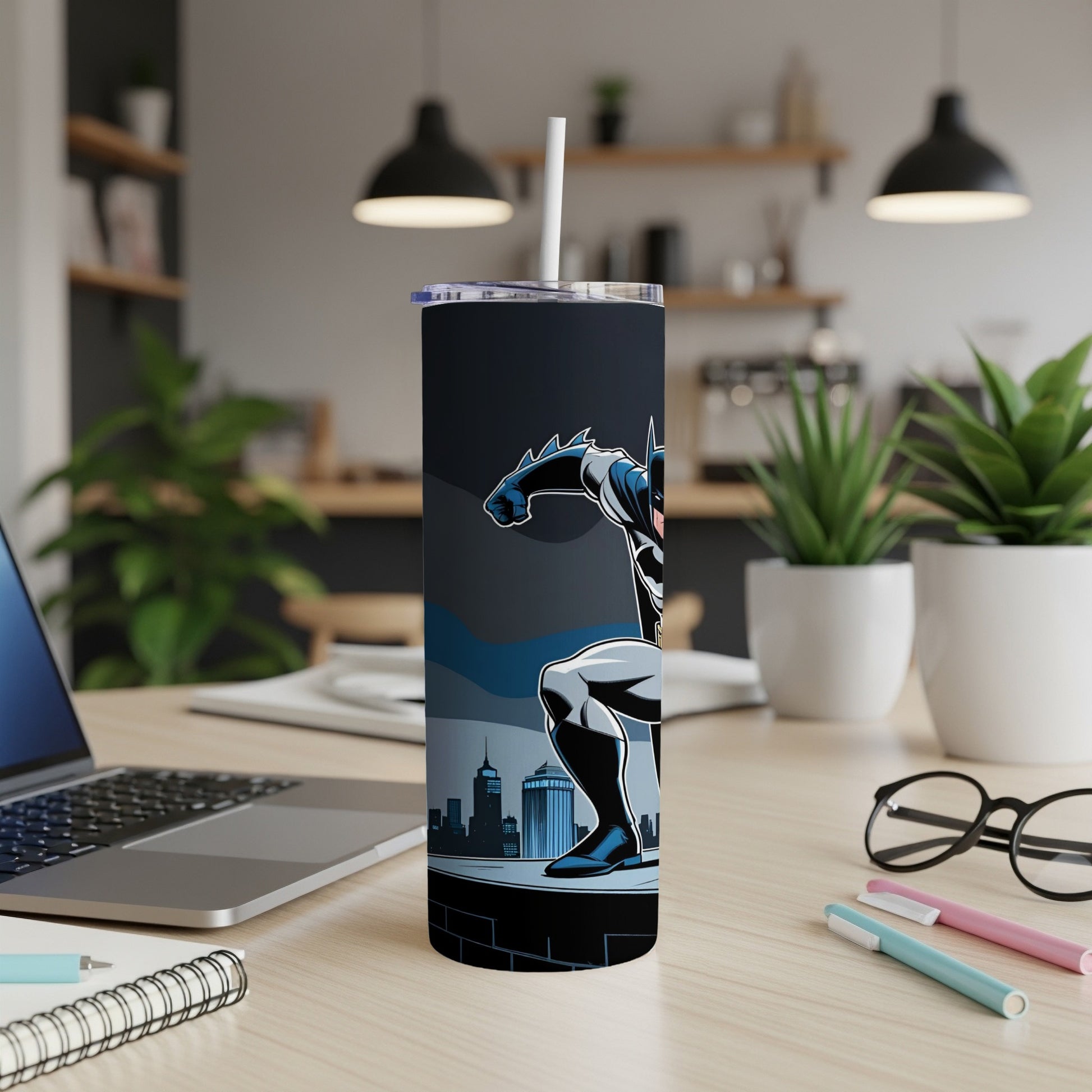Batman in a crouched pose on a cityscape backdrop, on a skinny tumbler.