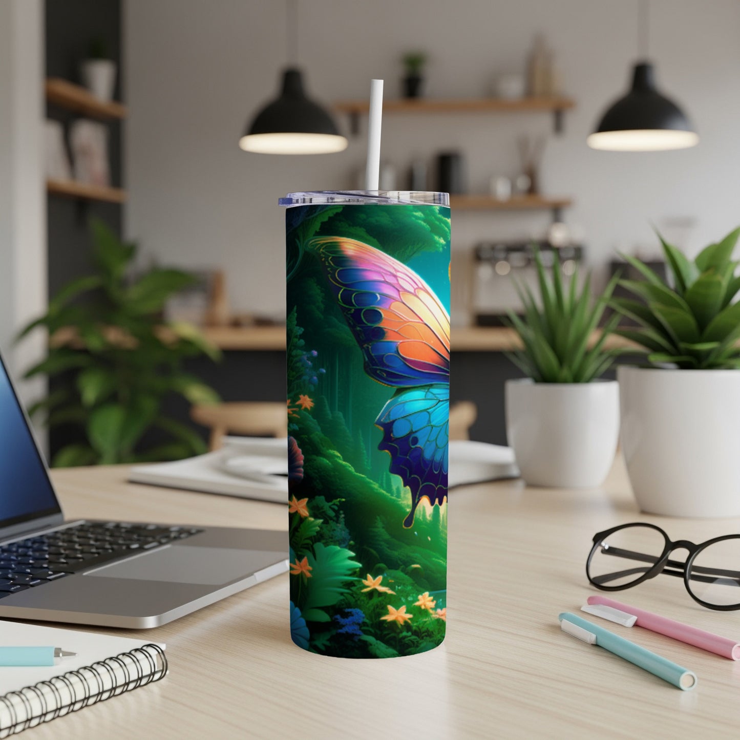 Butterfly design on a tall, insulated tumbler with a straw.
