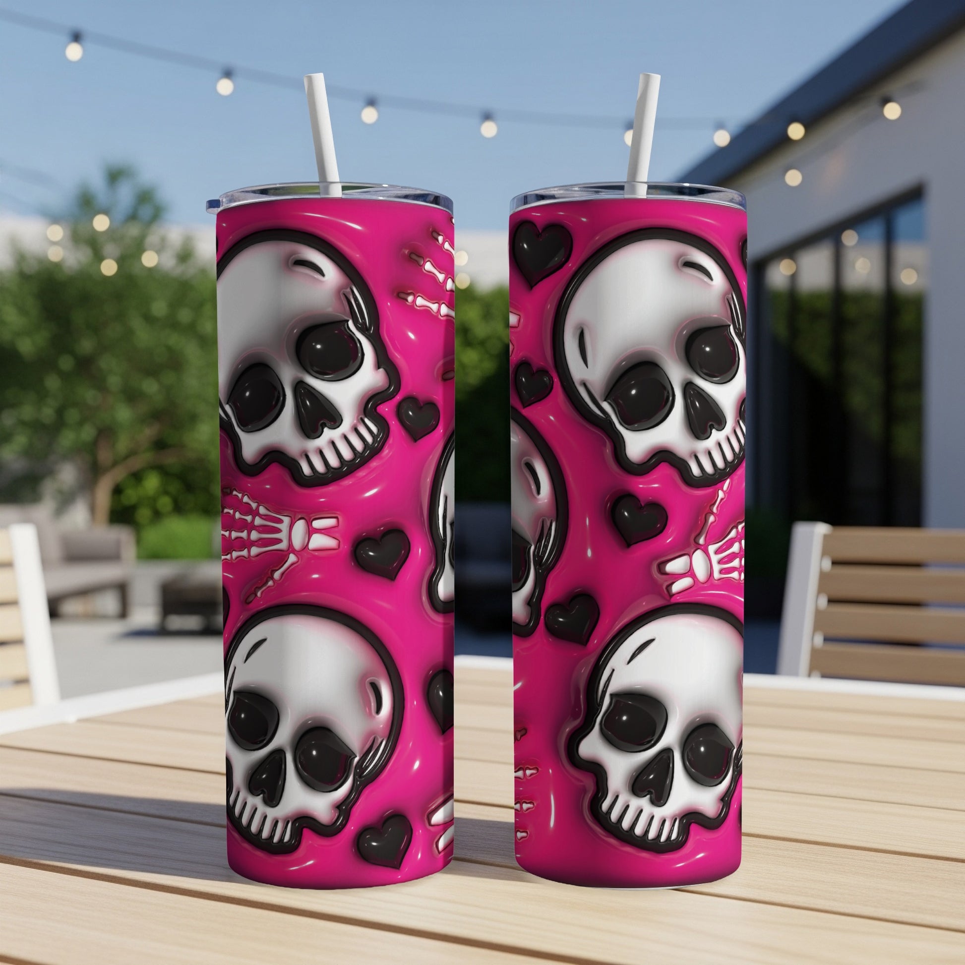 Two pink tumblers with skull and bone pattern.