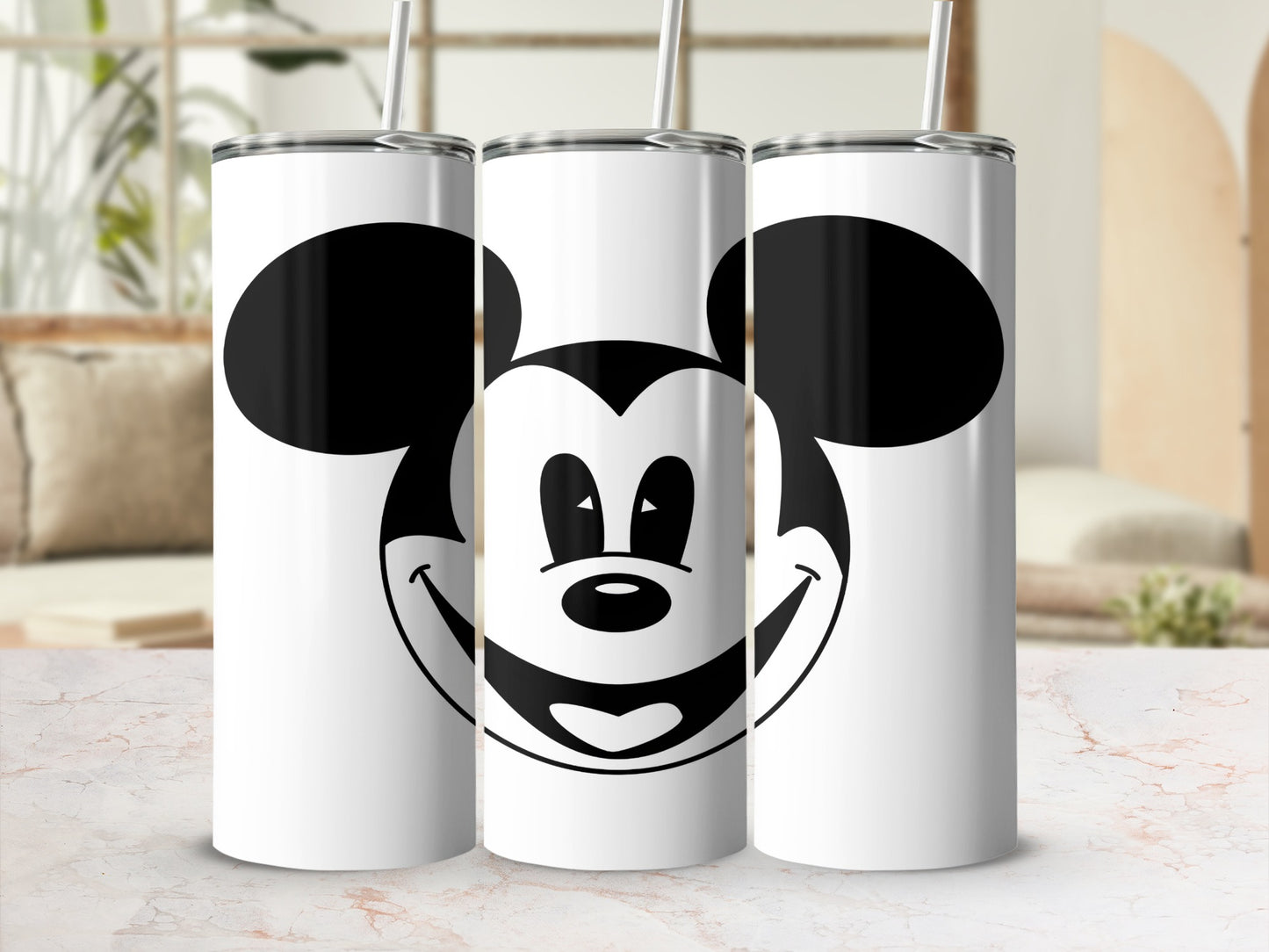 Three white tumblers with a Mickey Mouse face design.