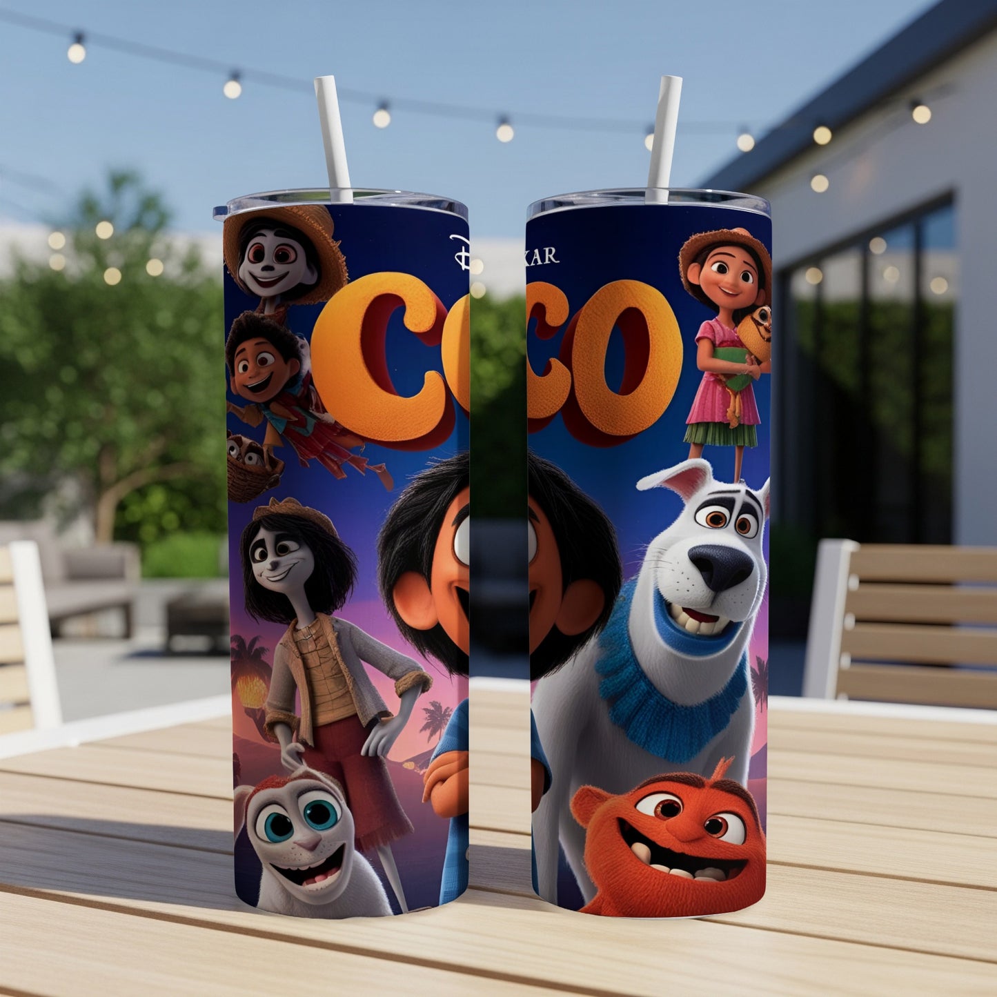 Disney Pixar Coco movie characters on a blue tumbler with a straw.