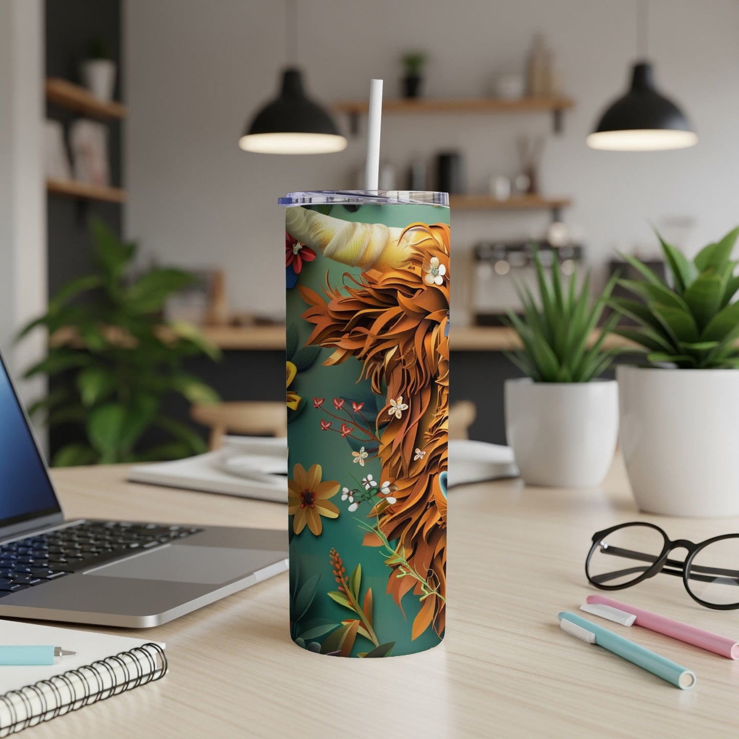 Tall tumbler with a Highland cow design and floral accents.