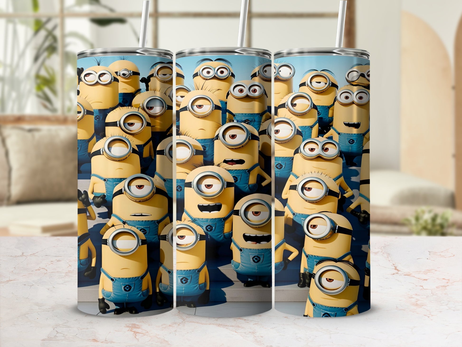 Three tall tumblers featuring multiple cartoon Minions in blue overalls.