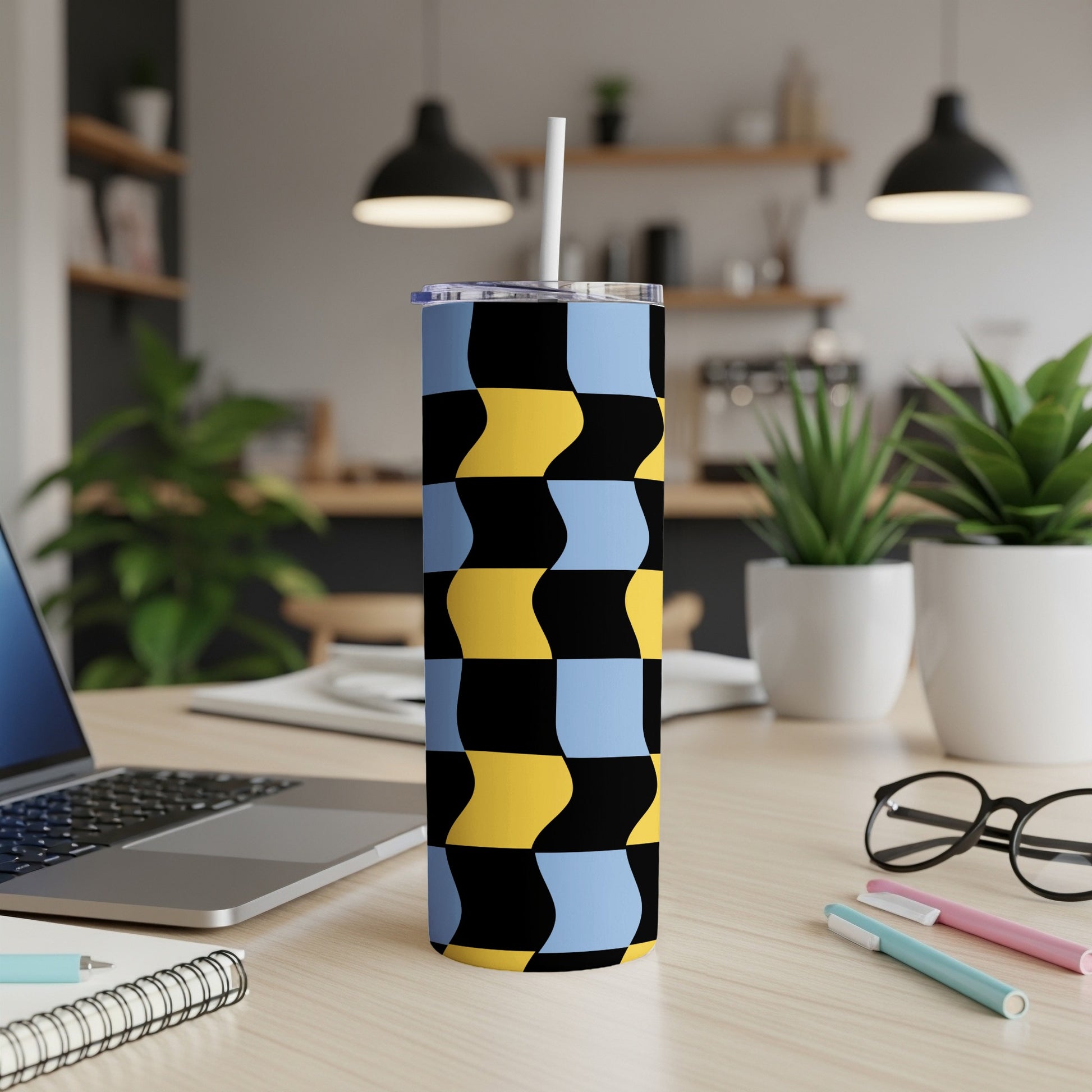 Tall tumbler with blue, yellow, and black wavy checkerboard pattern.