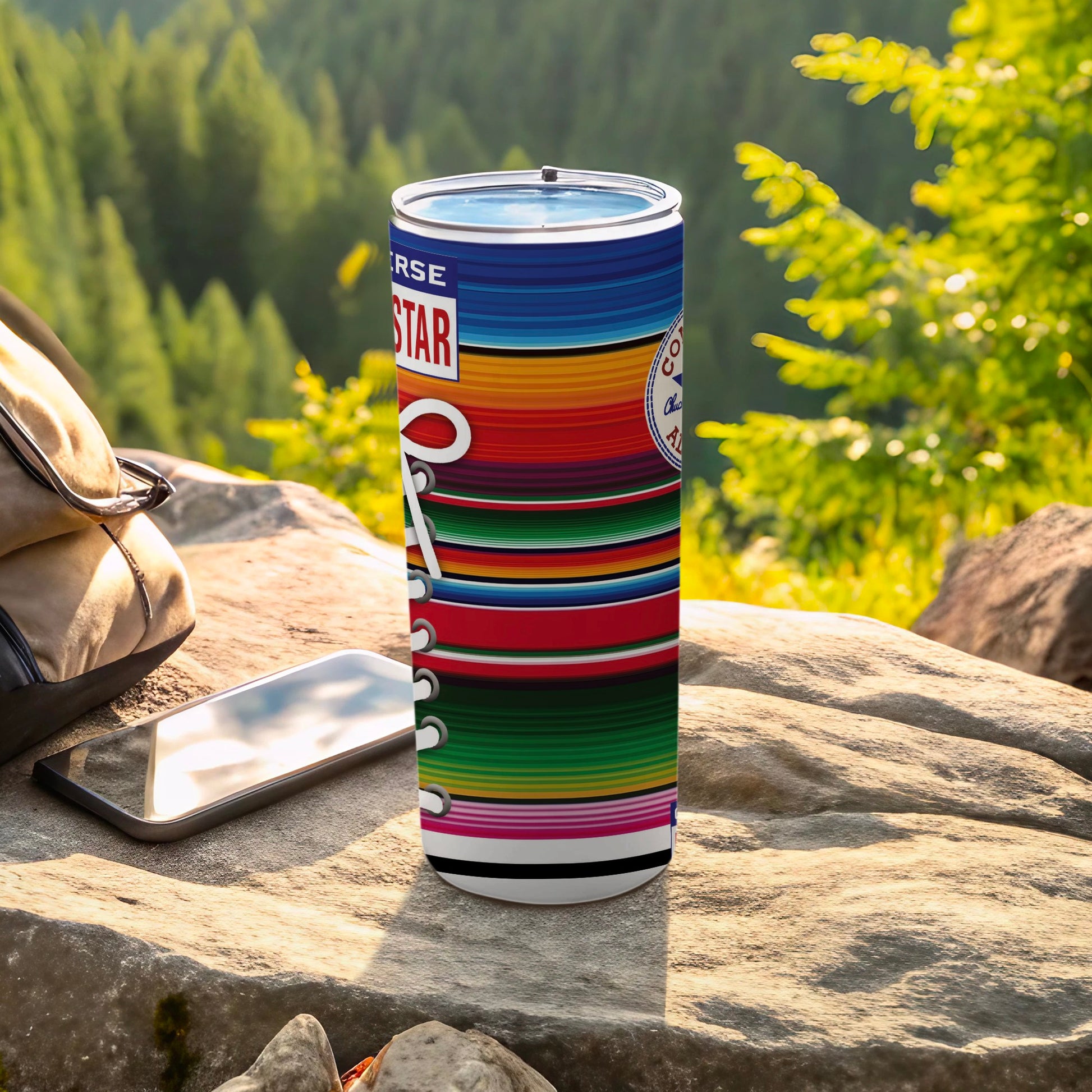 Converse tumbler with colorful stripe pattern and Converse logo.