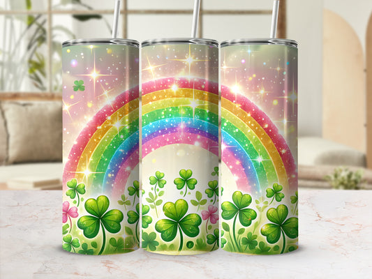 Three tumblers with shamrocks and a rainbow design.