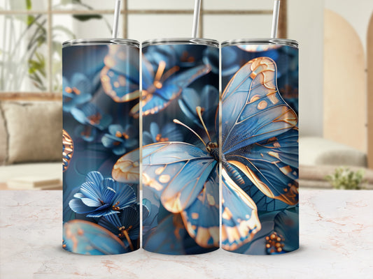 Blue and gold butterflies and flowers decorate a tall, slender tumbler.