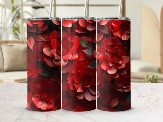 Triptych of red floral tumblers with straws, displayed on a countertop.