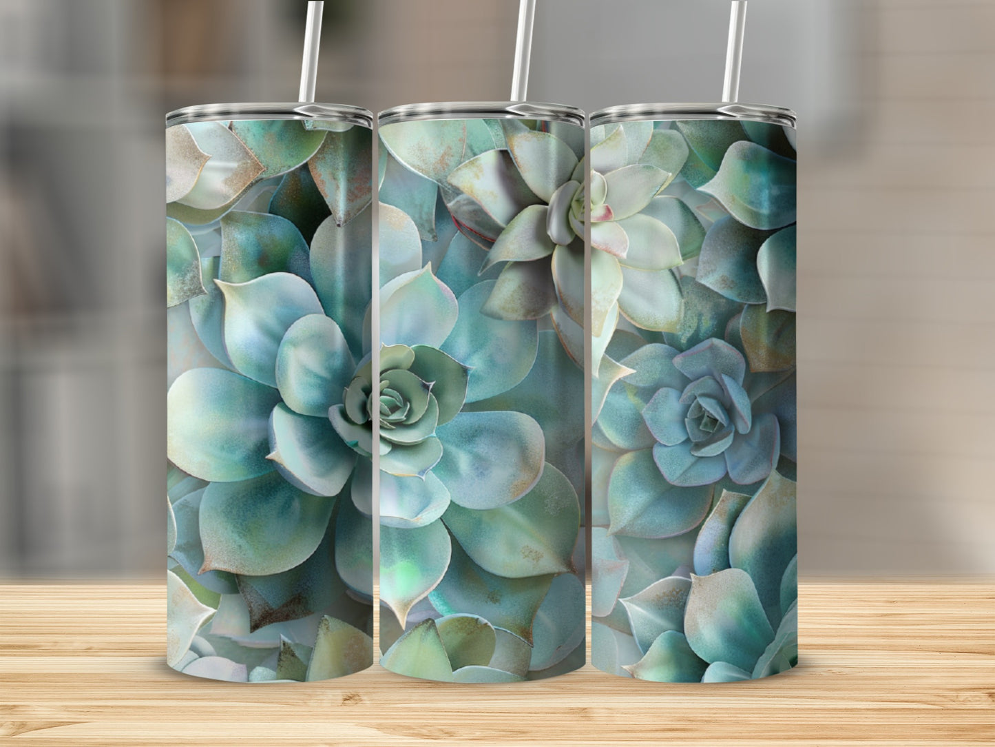 Three tumblers with a succulent plant pattern arranged side-by-side.