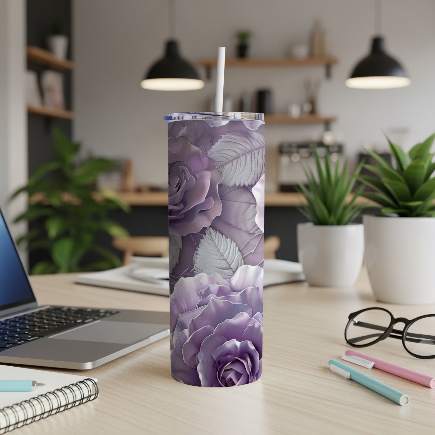 Purple and silver roses pattern on a stainless steel tumbler.