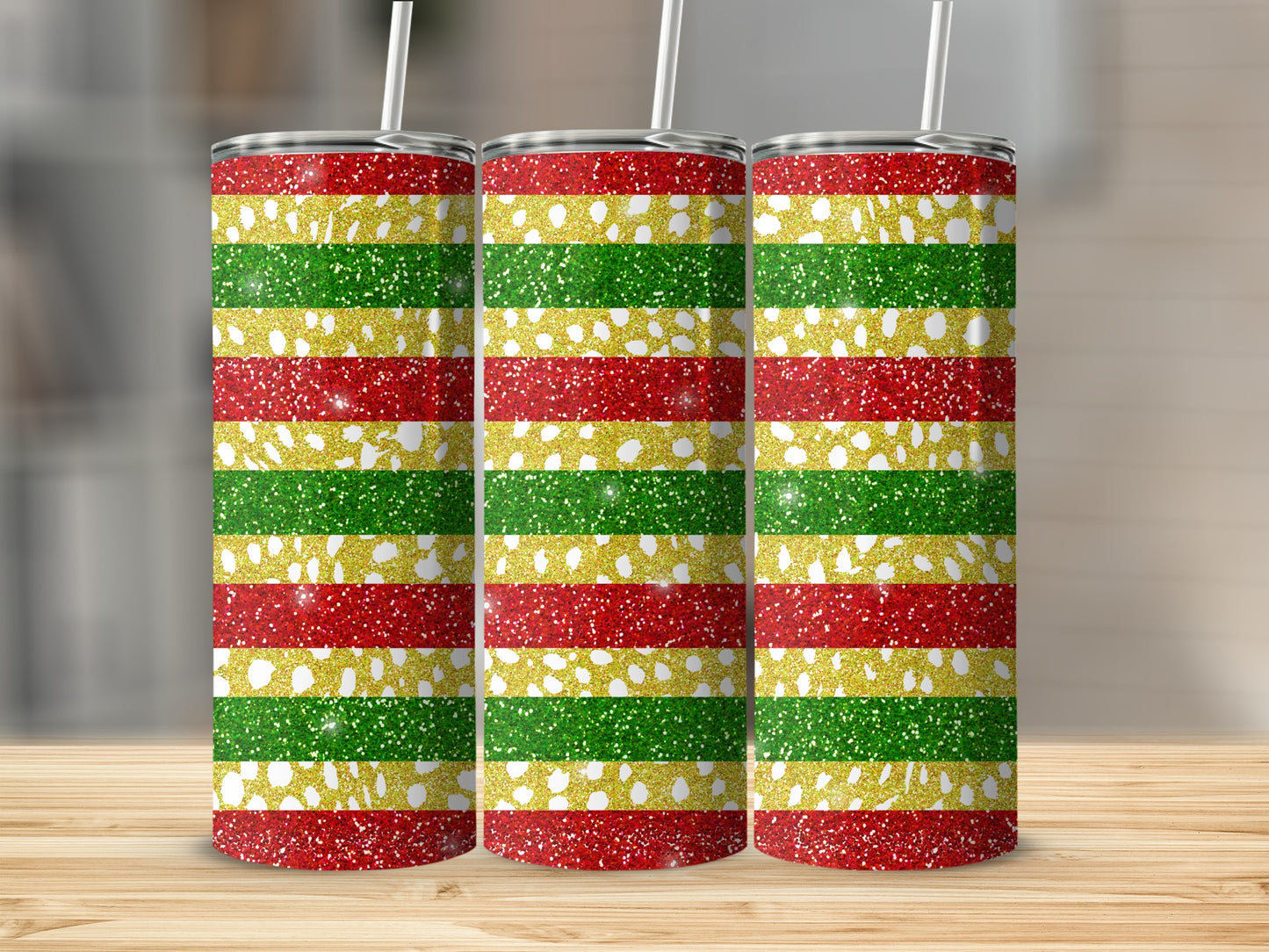 Three glittery tumblers with red, green, and gold stripes.