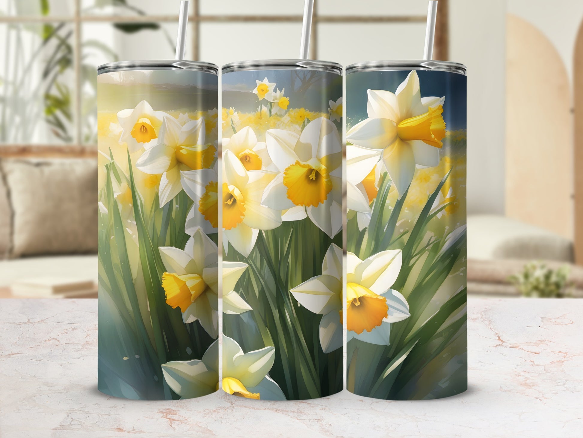 Three tumblers with a close-up watercolor print of yellow daffodils and green leaves.
