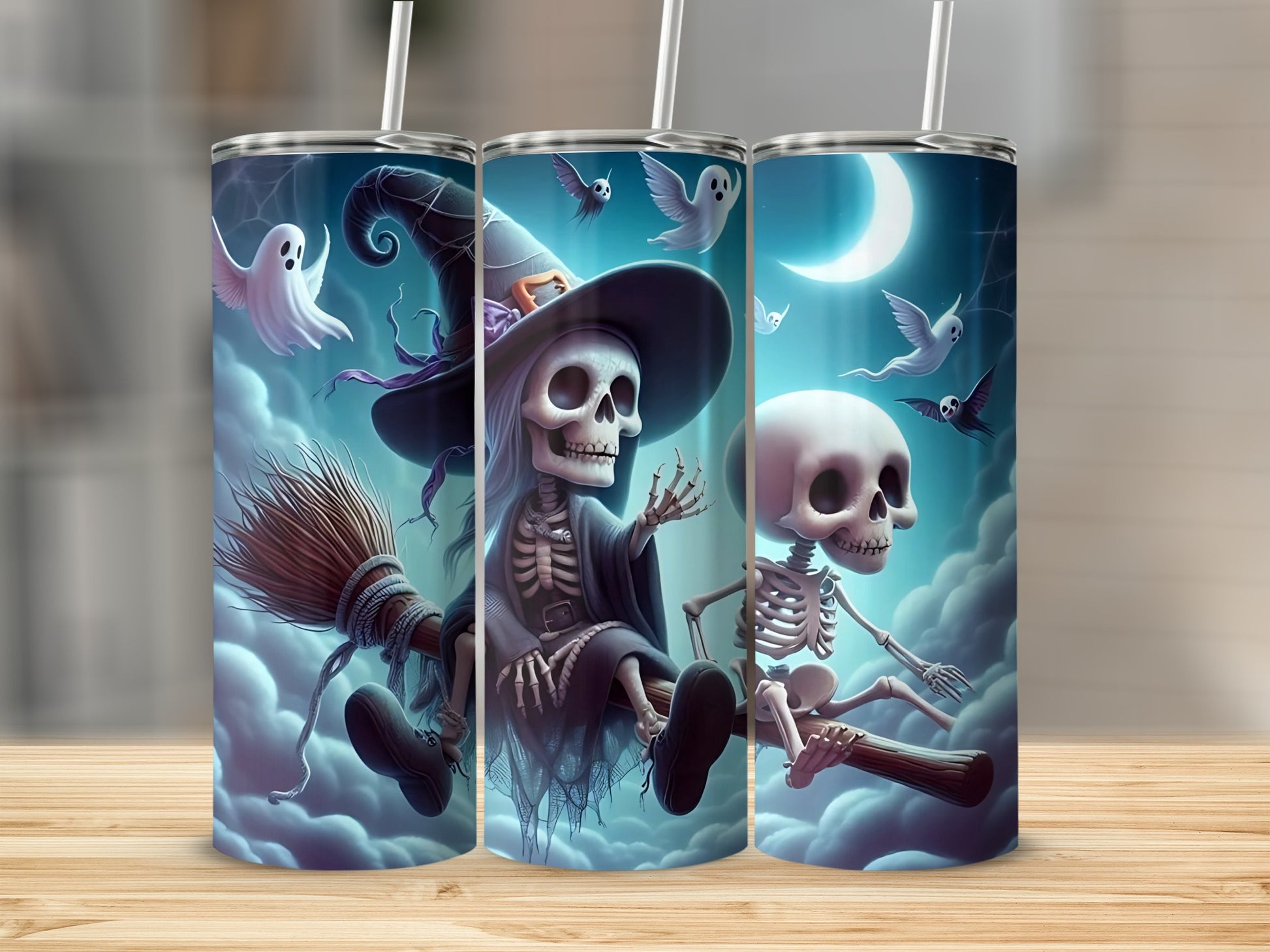 Three tumblers with Halloween skeleton and ghost graphics against a cloudy night sky.