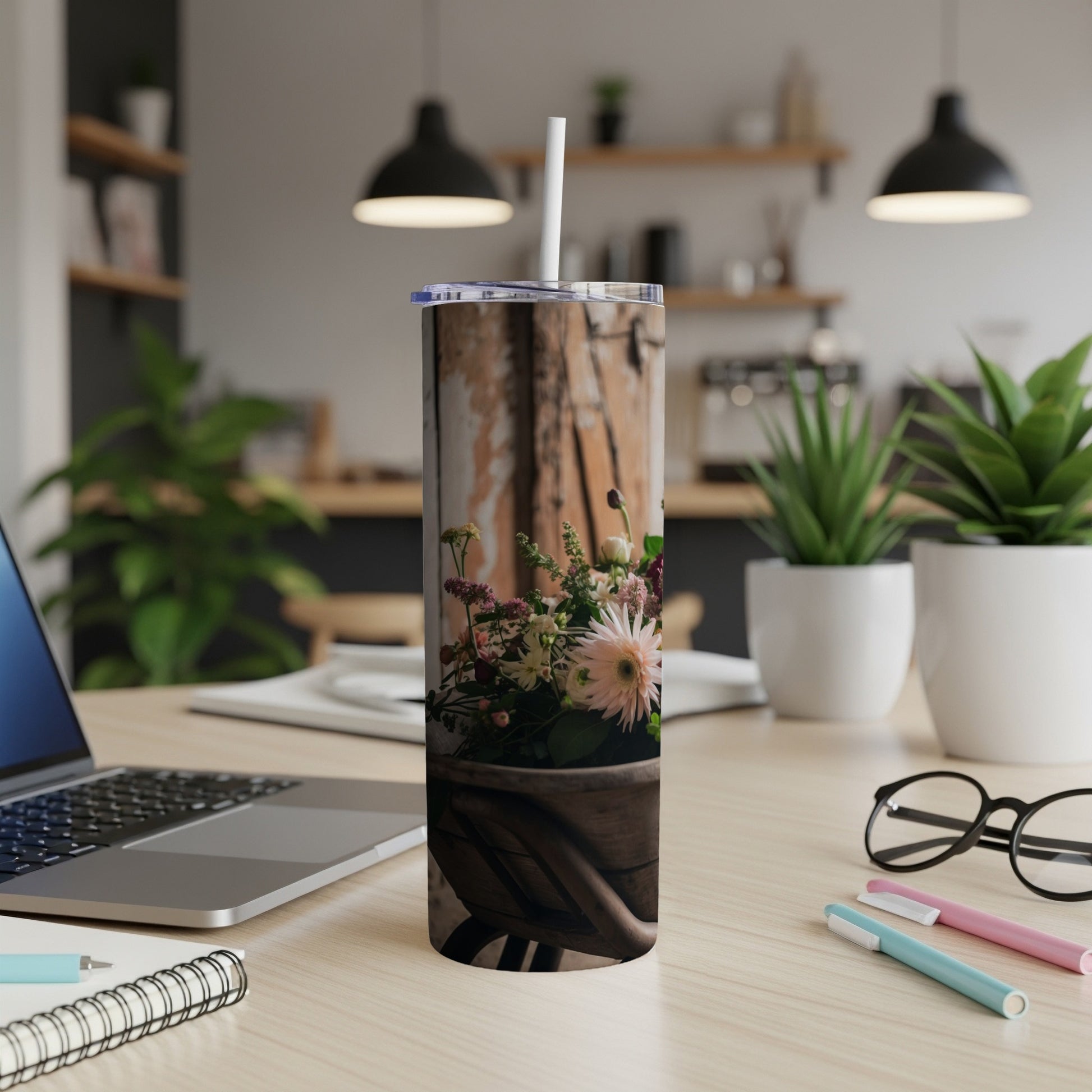 Wood grain tumbler with a floral arrangement and a straw.