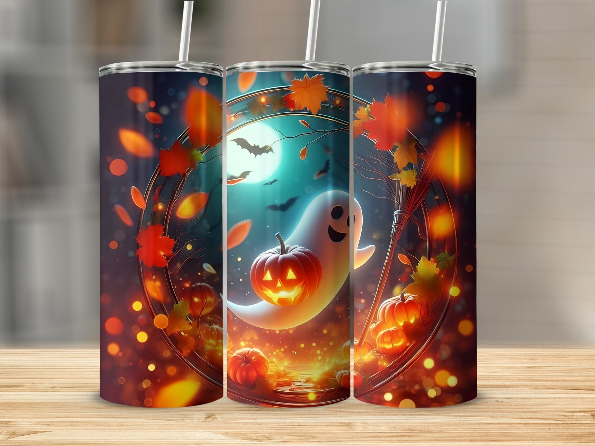 Three tumblers with a Halloween design of a ghost and pumpkins with falling leaves.