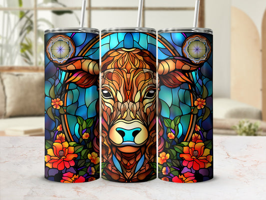 Stained glass cow head with floral accents on tumblers.