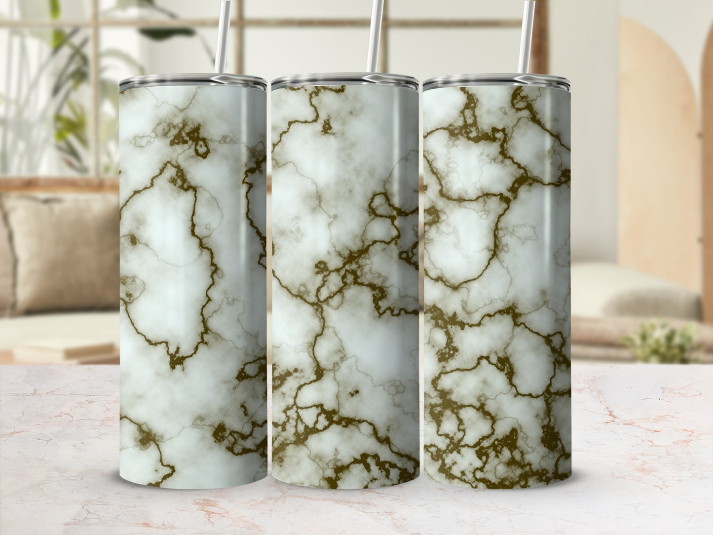 Three tumblers with white and gold marble pattern.