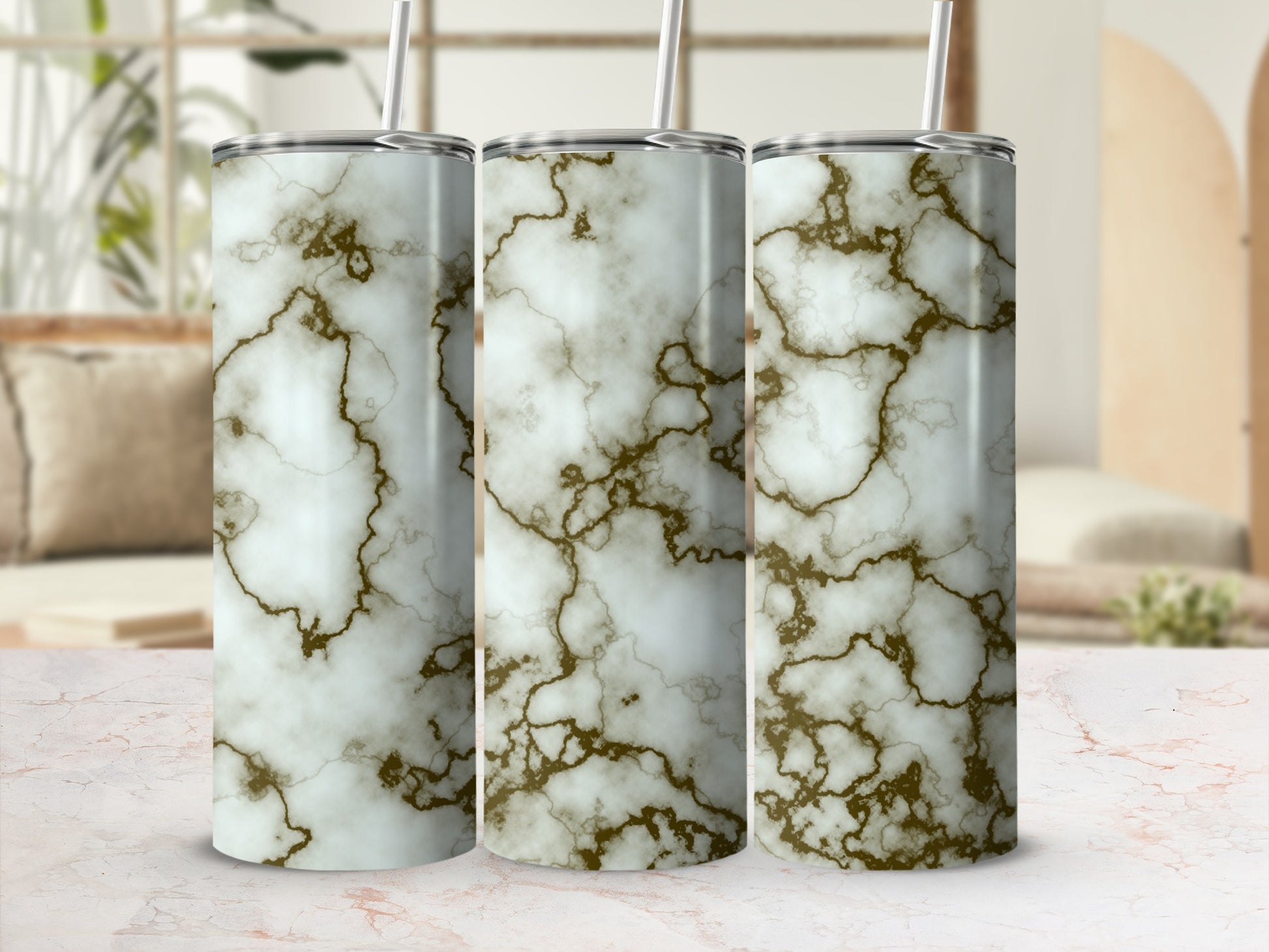 Three tumblers with white and gold marble pattern.