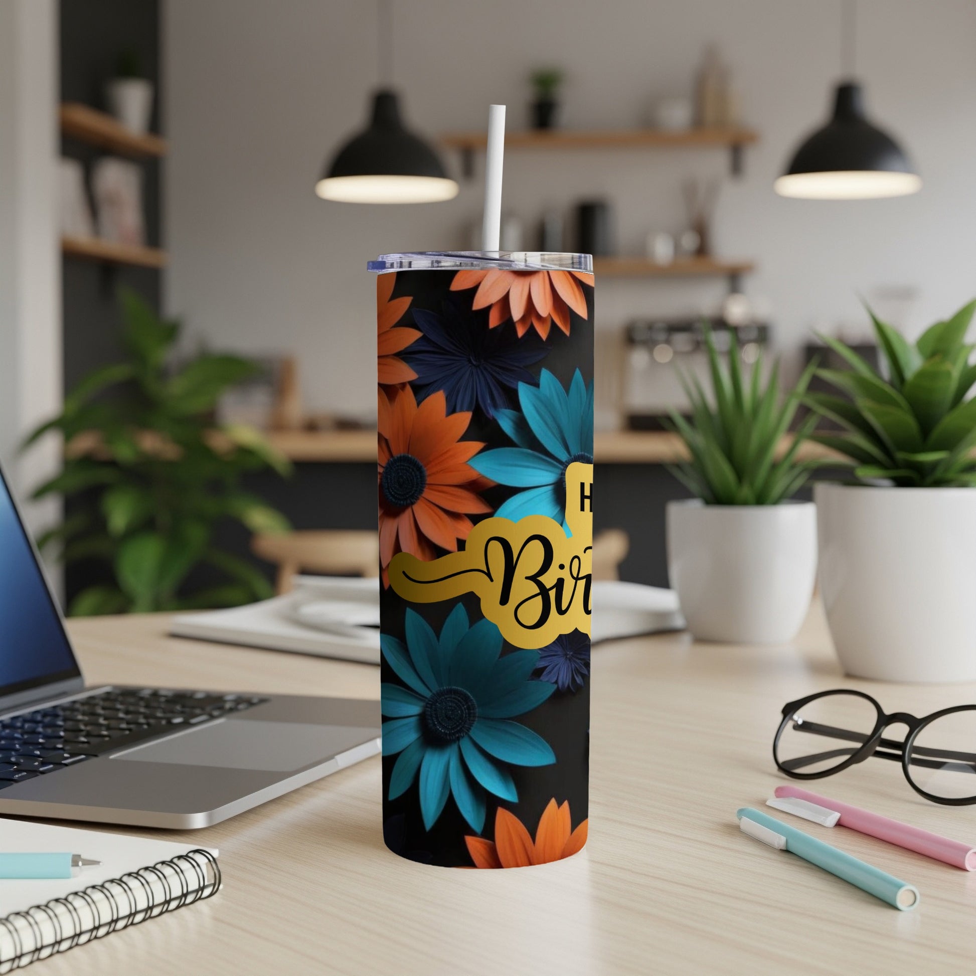 Black tumbler with orange and teal floral pattern and "Happy Birthday" text.